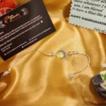 925 Silver Om Chakra Rakhi Bracelet (Blue-Yellow) RAK000051