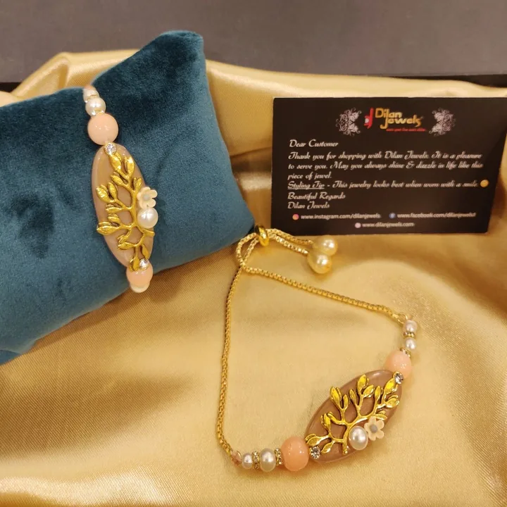 Embossed-Floral-Beige-Thread-Rakhi-with-Lumba-RAK08072210 Embossed Floral Beige Thread Rakhi with Lumba - Image 1