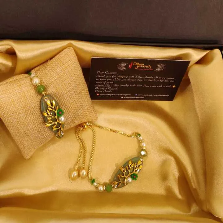 Embossed-Floral-Green-Thread-Rakhi-with-Lumba-Set-RAK08072208 Embossed Floral Green Thread Rakhi with Lumba Set - Image 1